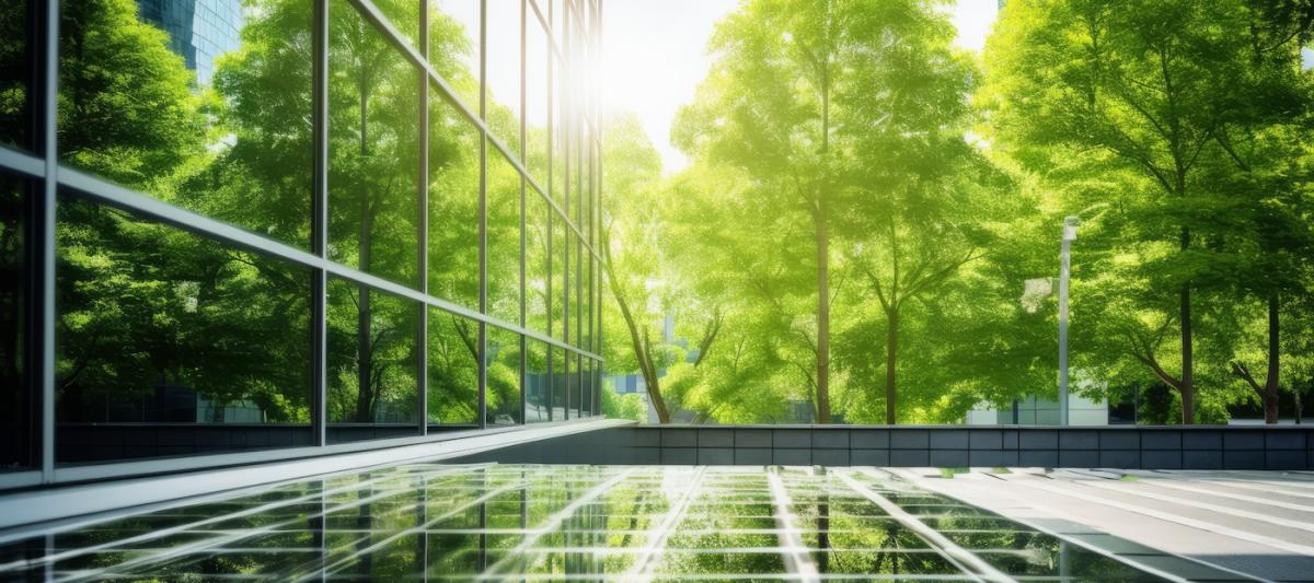 Reflecting greenery, a corporate glass building